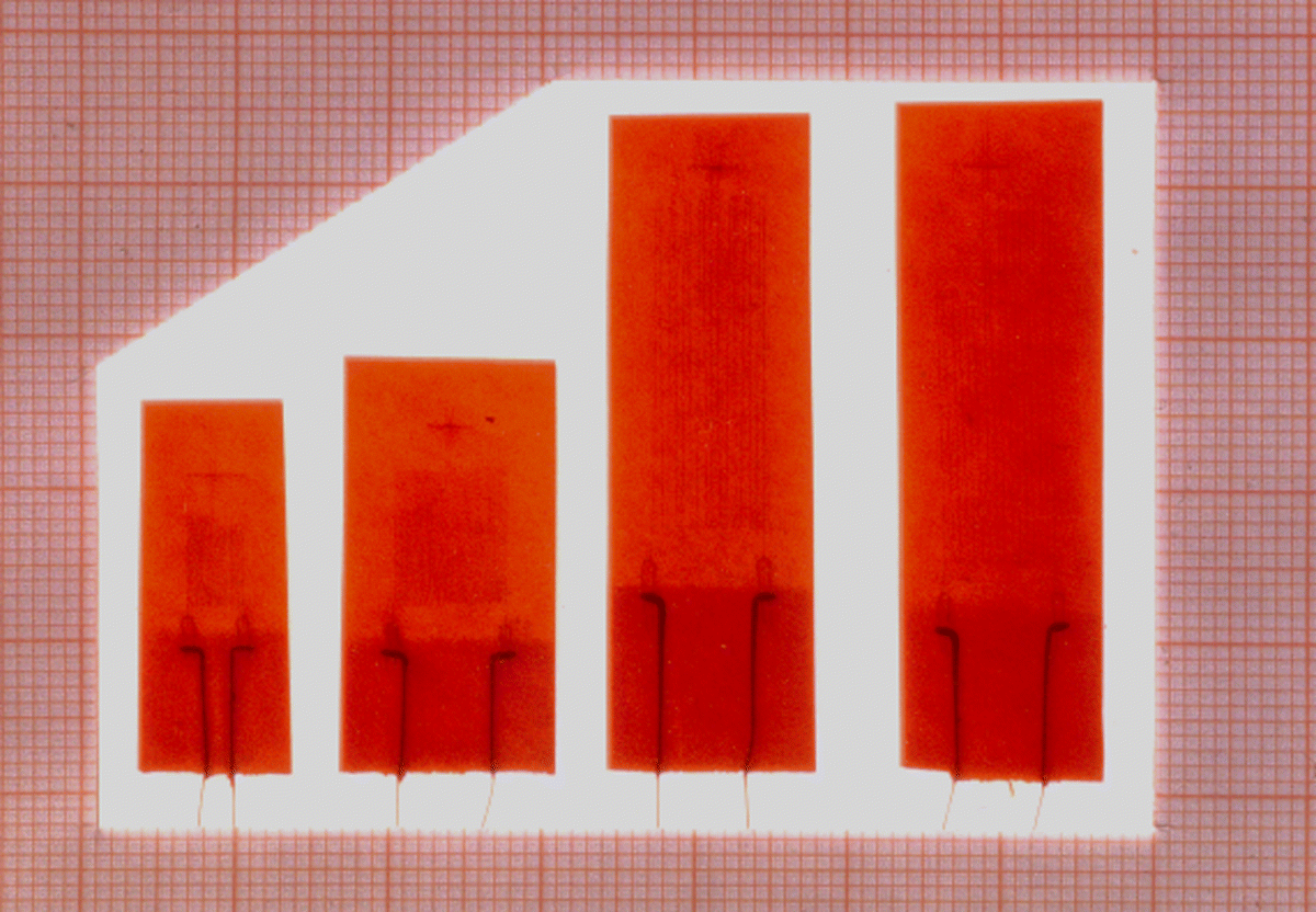 Figure depicting first strain gages manufactured by Hottinger Messtechnik GmbH in Darmstadt; they were flatgrid Bakelite gages. 