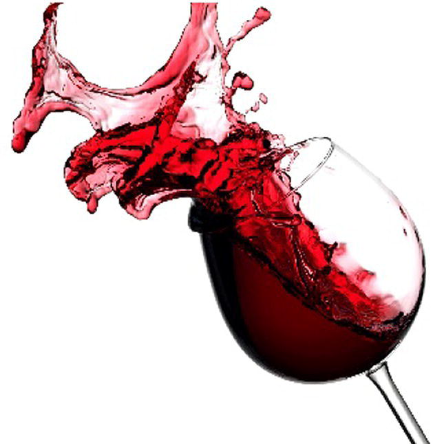 Photo displaying wine spilling out from a transparent glass.